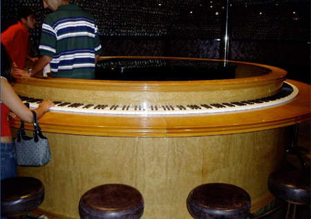 Sometimes those typical straight pianos just aren’t enough. This round one reminds us of a volume knob and you’d certainly need to crank up your energy to run around this piano.